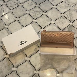 Brand new still in wrapping Lacoste slim zip wallet.  Box is a little worn.